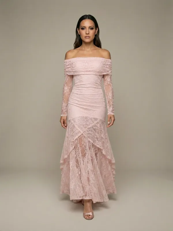 the same blush lace gown mid-step, the hem lifting off the studio floor