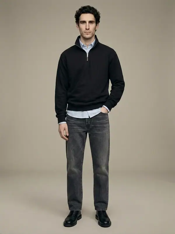 black quarter-zip funnel sweat over oxford worn by an AI male model, studio shoot