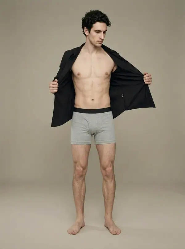 heather grey boxer briefs worn by an AI male model, studio shoot