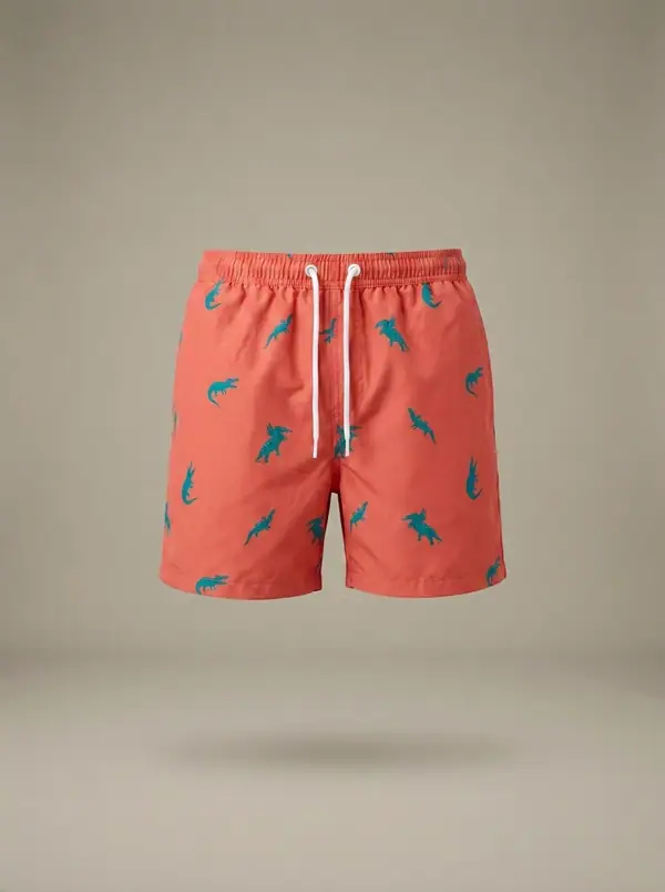 coral printed swim shorts, photographed as a product shot on a studio sweep
